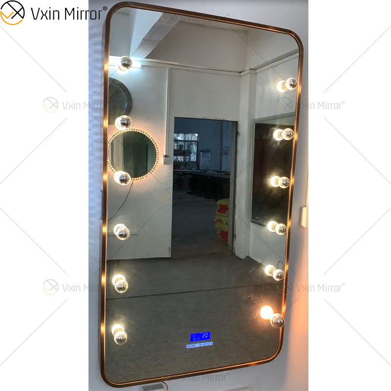 large mirror with lights around it